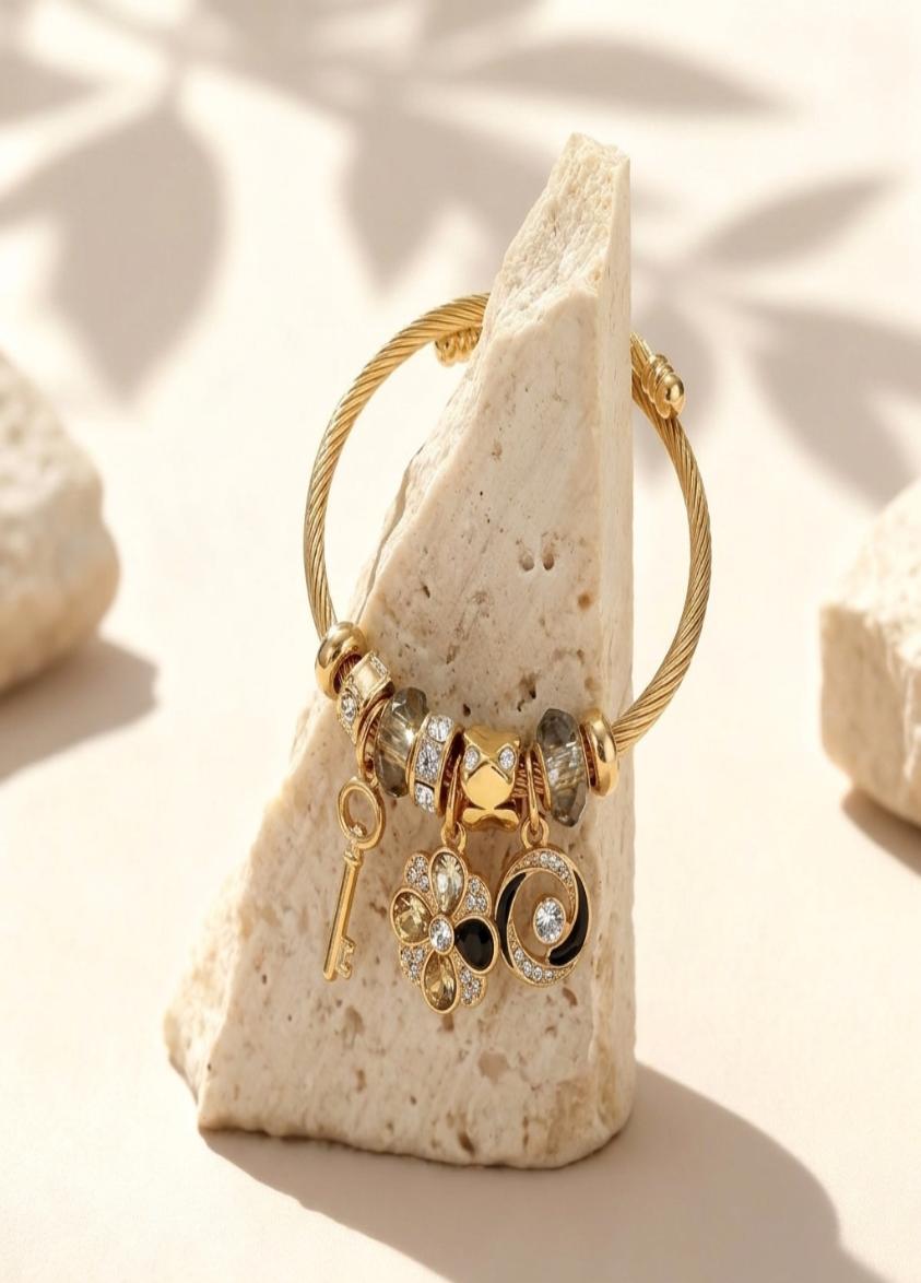 Multi Charm Gold Bangle (Emotional Lens: Memory, Continuity)