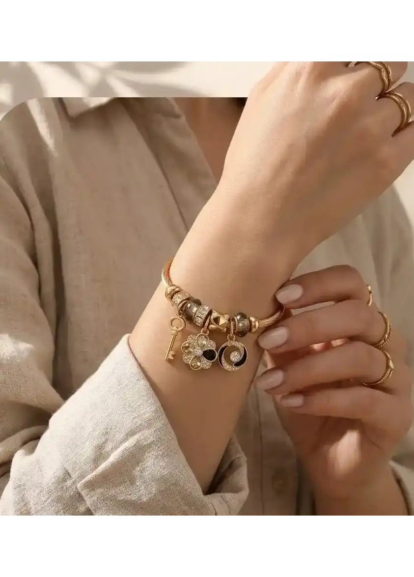 Multi Charm Gold Bangle (Emotional Lens: Memory, Continuity)