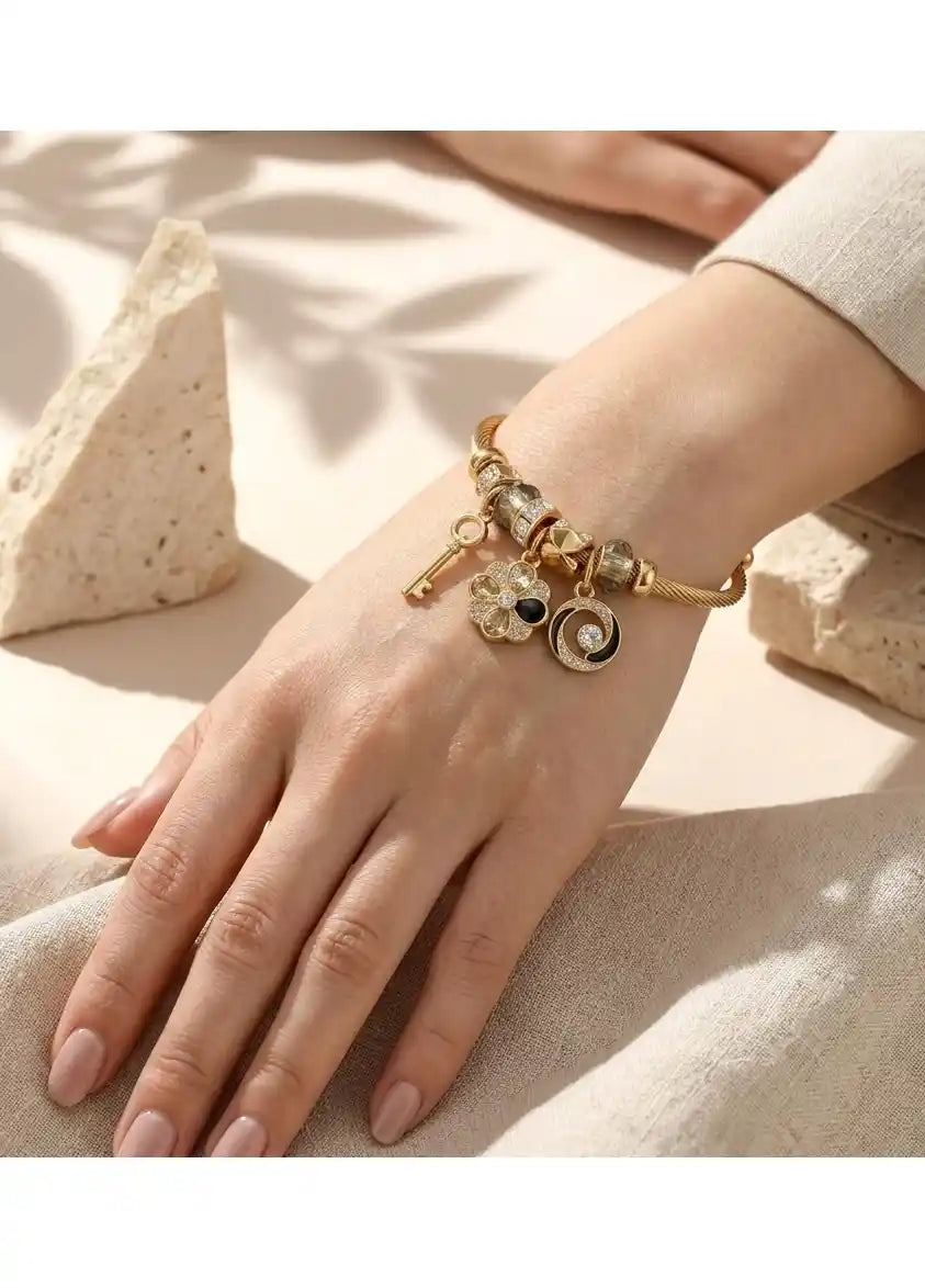 Multi Charm Gold Bangle (Emotional Lens: Memory, Continuity)
